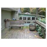 Rustic outdoor half barrel planters and park benches