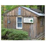 This wood shed serves up fuel for the wood burning stove that heats the home - home will be for sale