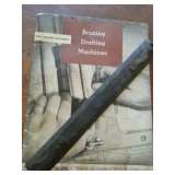 Early drafting table manual and cast iron rule