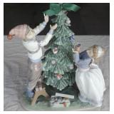 IET001  Lladro Trimming the Tree Porcelain Figurine