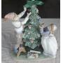 IET001  Lladro Trimming the Tree Porcelain Figurine