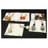 This lot contains five pairs of Myrna Lee earrings.  The first pair is peach colored and made from c