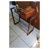 This lot includes a metal and wood shoe rack, a shoe shine kit 7.5" x 10.5" and some polish. 28 " x 
