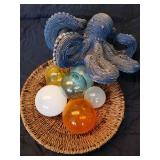 This lot contains a whimsical version of a blue octopus with a nest of "eggs". Octopus measures abou