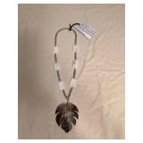 ICT437 Myrna Lee Chang Carved Shell Monstera Leaf Necklace 