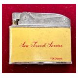 SST378 - Vintage Penguin Lighter with advertising for Sun Travel Service based in Yokohama, Japan