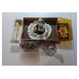 PPE026-Assorted Figurines, lei, flowers and a wind chime