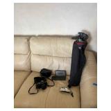 AWT309 Canon T70 Film Camera, Canon Intelligent Dictionary, Crank Emergency Radio, And Tripod