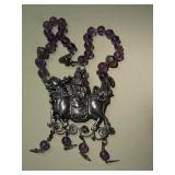 Chinese silver animal with rider and amethyst beads