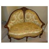 antique, highly carved love seat