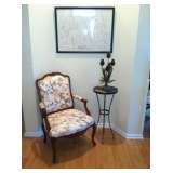 Lovely chair with art and plant stand