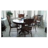 circular antique table and chairs