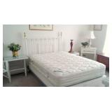 queen bedreoom with metal bed and wicker dressers