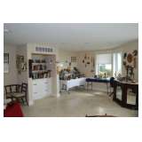 Downstairs, Napolean chair, books, artwork