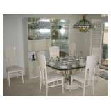 Glass pedestal dining table