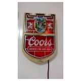 Coors beer sign lighted