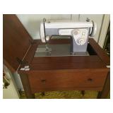 Sears Kenmore sewing machine in cabinet