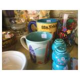 Colorful mugs, salt and pepper shakers