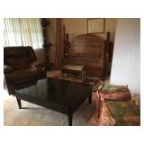 Brown leather recliner, full bed, coffee table 