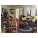 plaid sofa, braided rug, cofee table