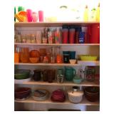 Closet full of poolside Colorful Plasticware