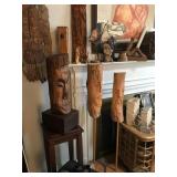 Collection of hand carved and bronze faces