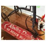 Vintage tricycle and #10 Roller Derby skateboard
