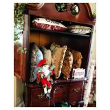 Armoire full of Needlepoint pillows
