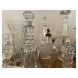 Collection of cut crystal and glass decanters  