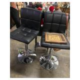 Matching pair of black leather bar stools 