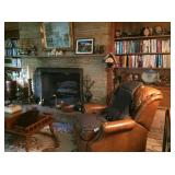 leather recliner, books, decoratives