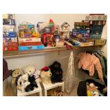 Collection of puzzles, games and stuffed animals