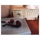 Pipes, jewelry box and clock radio