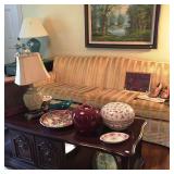 Gold/Creme fabric sofa, coffee table, lamps, art and decoratives
