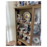 Antique China Cabinet filled with porcelain figurines and decoratives