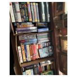2 linear feet of VHS and DVDs