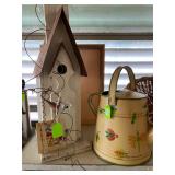 Decorative bird house and watering can