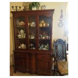 China hutch and decoratives including various Disney characters