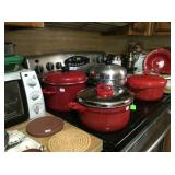Red cookware, toaster oven, bun warmers
