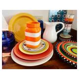 Colorful dishes by Elite and PT demitasse cups on a stand