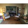 Leather chair, sofa, lamps, art