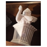 Cherub blowing kisses