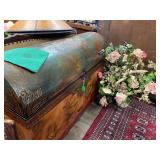 Round dome shaped hand painted chest and floral arrangements throughout shop