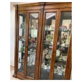 Large curio cabinet, mirrored back panel with lights and filled with treasures, Santa collection tea
