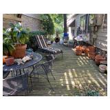 Patio filled with treasures including a Chemenea