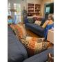 Living area with fabric couch, sofa, pillows, and more