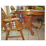 Kitchen table with leaf, four chairs, matching hutch