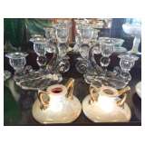 Several candelabras and candle holders