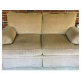 Puffy neutral-toned love seat