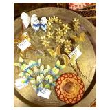Brass tray table with butterfly wall decor on top